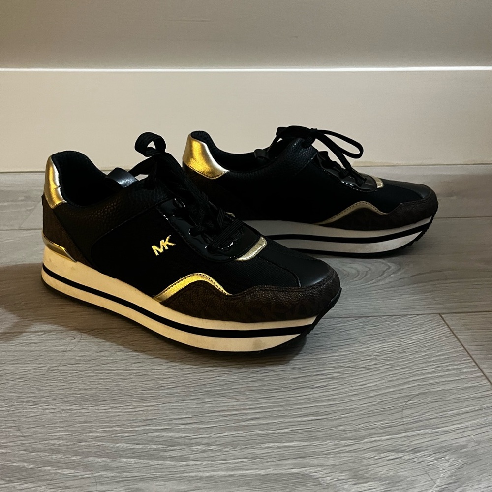 Michael Kors Black Sneakers with Gold Highlights.